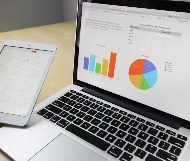 laptop with data charts